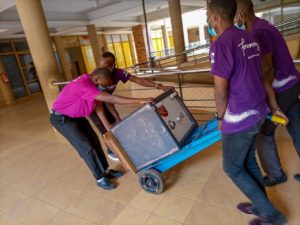 Nellions's staff moving a safe deposit boxes